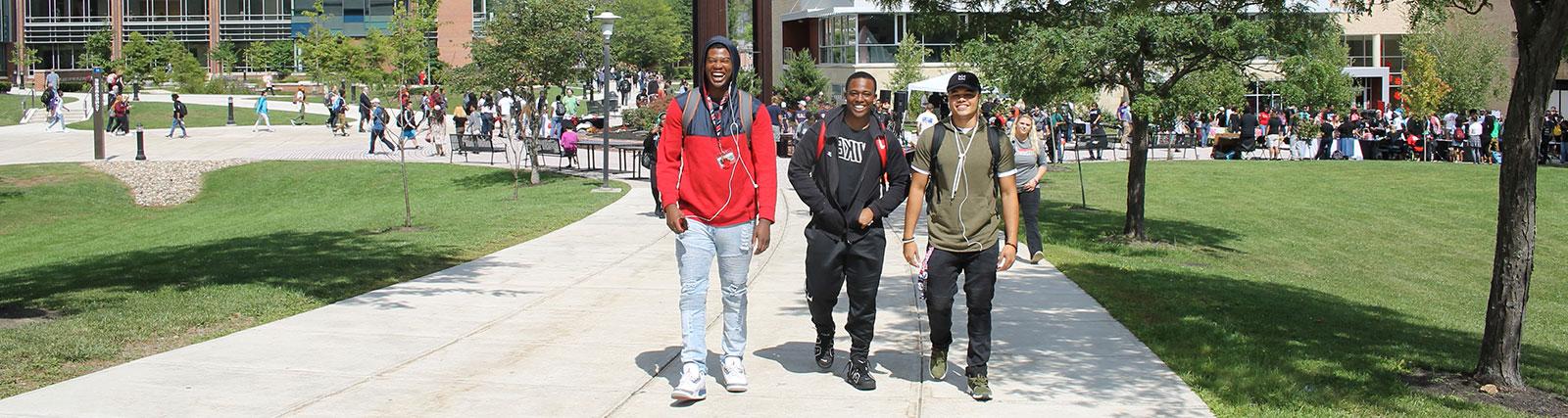 Three smiling students  